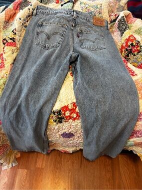 Levi's light blue denim jeans with tan leather patch